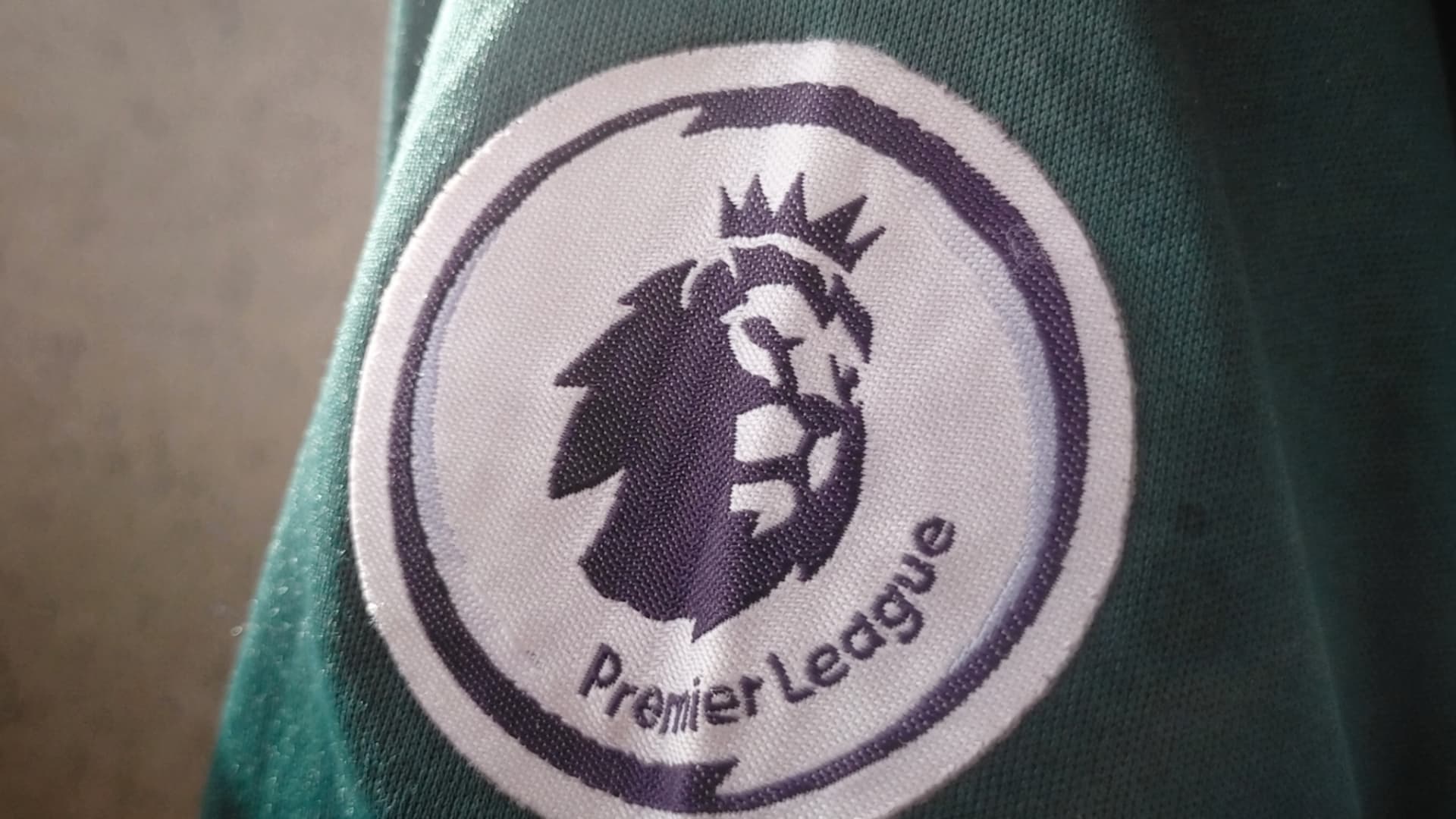 Premier League badge on a shirt sleeve